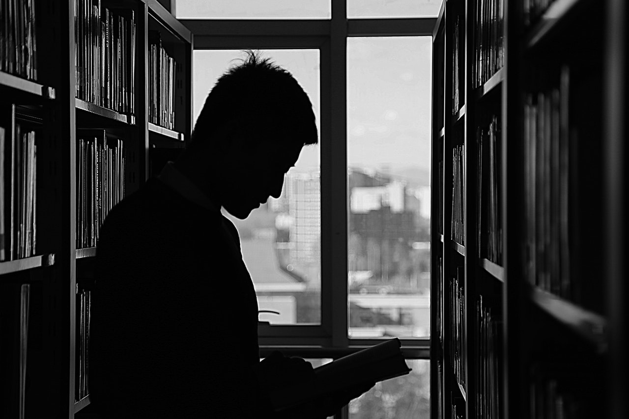 Man reading in library